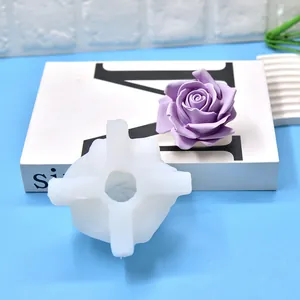 Close-up detail of 3D rose silicone mold alongside a finished purple aromatherapy candle