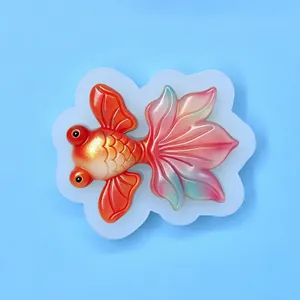 Close-up detail of a goldfish silicone mold showing the intricate scales and tail fins