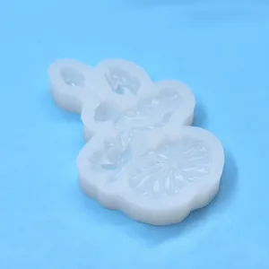 Close-up detail of the translucent silicone mold with lotus and goldfish patterns