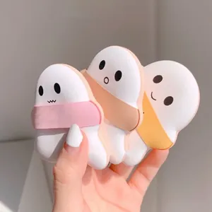Close-up view of cute ghost-shaped marshmallow cushion makeup puffs in three soft colors
