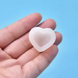 Close-up detail of a heart-shaped silicone mold showing the size and translucent texture