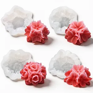 Detailed view of four intricate floral silicone molds with finished pink flower candles