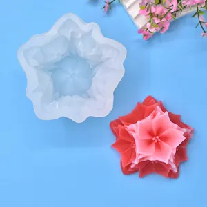 Top-down macro view of a floral silicone mold and its detailed 3D flower candle output