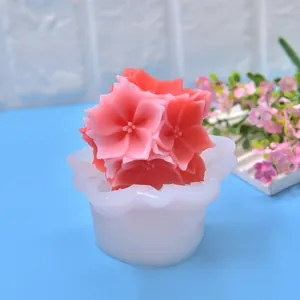 Detailed view of a flower silicone mold with a finished pink floral candle inside