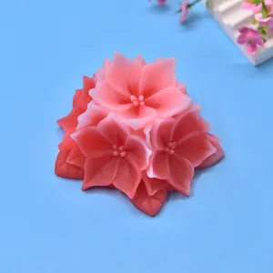 Detailed view of a pink floral-shaped aromatherapy candle made from a DIY silicone mold