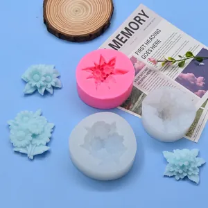 Detailed view of flower silicone molds and finished light blue daisy soaps on blue background