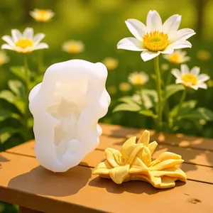 Detailed view of a 3D lily flower silicone mold with a finished yellow plaster flower