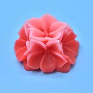 Macro view showing intricate details of pink floral scented candle made from DIY silicone mold