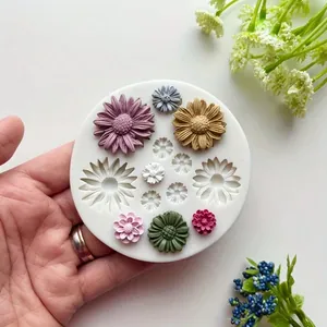 Detailed view of circular silicone mold featuring various daisy and chrysanthemum floral patterns