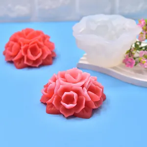 Detail showing 3D flower silicone mold and finished pink rose aromatherapy candles