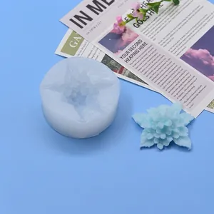 Detailed view of flower silicone mold with a finished blue floral wax petal craft for DIY