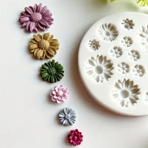 Detailed view of multi-size daisy flower silicone mold with colorful resin flower samples