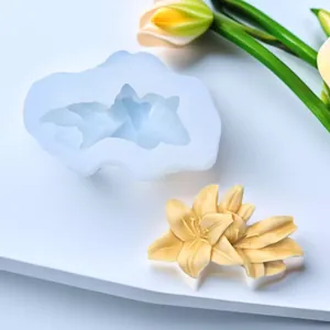 Detailed view of 3D lily flower silicone mold alongside a finished plaster craft sample