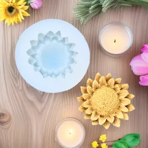 Close-up of sunflower silicone mold and finished handmade yellow floral candle on wood