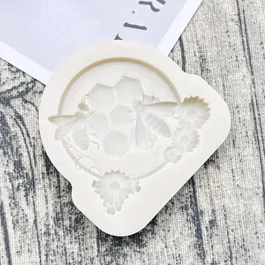High-detail shot of bee and honeycomb pattern silicone mold for fondant or resin