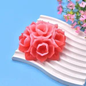 Detail shot of a pink peony-shaped handmade candle crafted from a silicone mold
