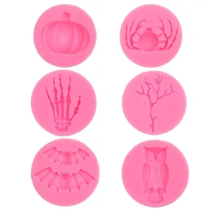 Set of pink Halloween silicone molds featuring pumpkin, spider, owl, and bat patterns.