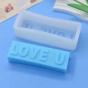 Close-up of LOVE U rectangular silicone mold and its blue soap finished product