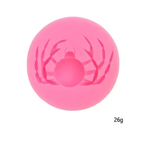 Detailed view of a pink spider pattern silicone mold for Halloween DIY baking projects