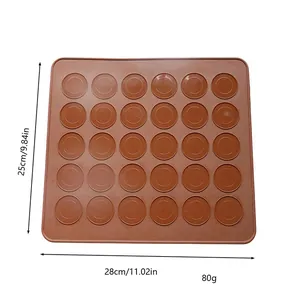 Brown silicone macaron baking mat detail showing 28x25cm dimensions and 80g weight