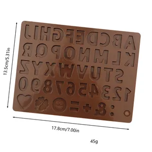 Detail of brown silicone mold with alphanumeric characters and symbols for DIY chocolate