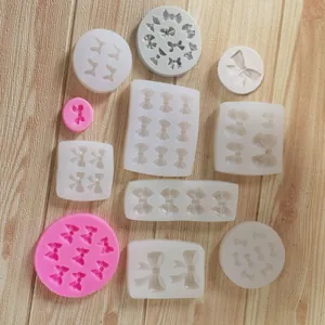Variety of bow-shaped silicone molds for fondant and chocolate cake decorating