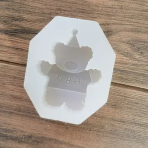 Detailed view of hexagonal bear-shaped silicone mold with HBD engraving for DIY crafts