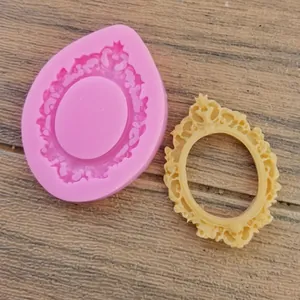 Detailed view of pink silicone mold and vintage floral relief frame cast on wood
