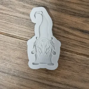 Detailed macro view of a Christmas gnome silicone mold for fondant and epoxy resin crafts.