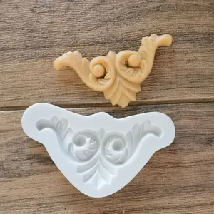 European vintage scroll relief silicone mold with finished resin decor piece on wood
