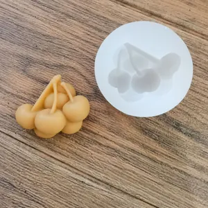 Macro detail of a fruit-shaped cherry silicone mold for chocolate and clay crafting