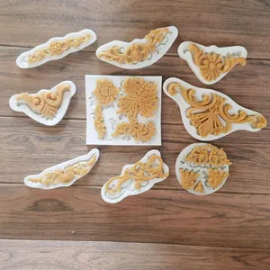 Detailed view of assorted baroque floral silicone molds for fondant cake decoration