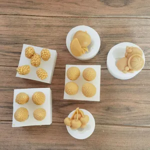 Detailed macro view of assorted fruit-shaped silicone molds for chocolate or clay