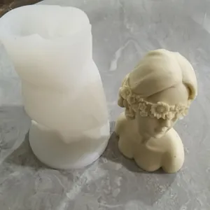 Silicone mold and finished bust of a blindfolded flower girl for DIY candle making
