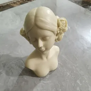 Detailed view of a closed-eye girl sculpture with rose flowers for DIY candle making