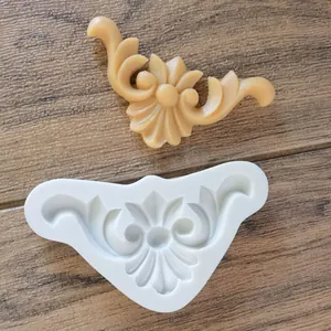 Detailed view of European baroque relief silicone mold with sample fondant piece