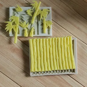 Close-up detail of bamboo and leaf texture on white silicone cake decorating molds