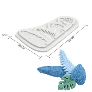 Detail view of leaf-shaped silicone mold with 92x70mm dimensions and finished samples