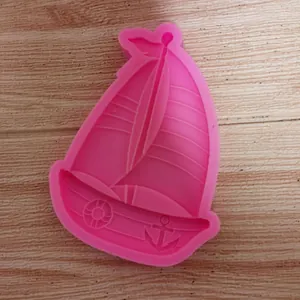 Sailboat shaped pink silicone mold for DIY resin and fondant crafts detail.