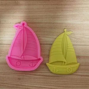 Detailed view of the sailboat silicone mold with its finished yellow clay ornament
