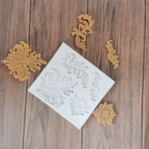 Close-up detail of a white silicone mold featuring retro European floral relief patterns
