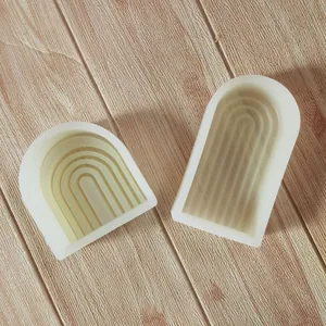 Detailed view of geometric arch and N-shaped silicone molds for DIY candle making crafts