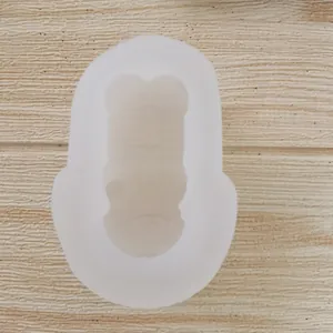 Vue de dessus d'un moule en silicone 3D en forme de tigre pour bougies et pâtisserie.