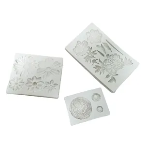 Set of three white flower-patterned silicone molds for DIY fondant and chocolate crafting