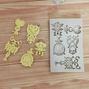 Detailed macro view of European vintage relief silicone mold with finished fondant pieces