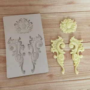 Detail of European relief fondant silicone mold with baroque scroll and floral patterns