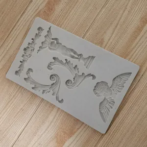 Detailed macro view of a gray silicone mold with European relief and angel motifs