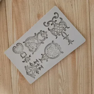 Detail view of ornate Baroque relief patterns in a gray silicone fondant craft mold