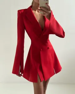 Detail view of a vibrant red double-breasted blazer dress with flared sleeves