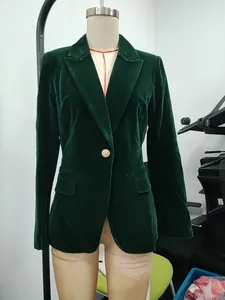 Front view of a dark green velvet blazer jacket on a mannequin with gold button